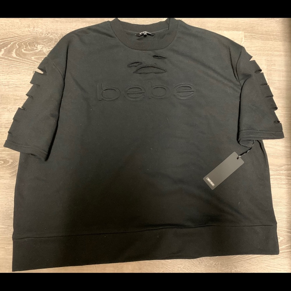 NWT! Bebe Sweater Shirt with rips.